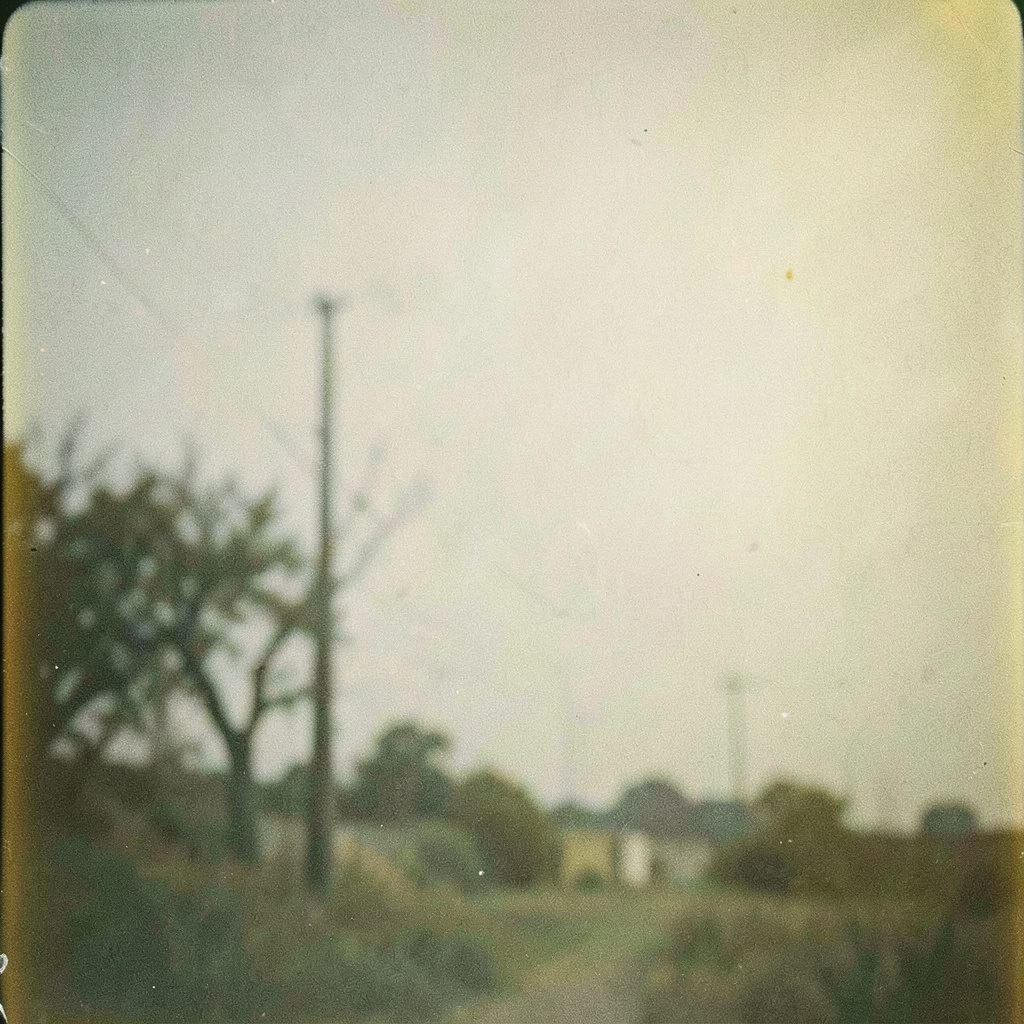 A grainy analog film photograph of a WordPress editor screen with the post title visible, in muted whites and soft blue-grey tones.